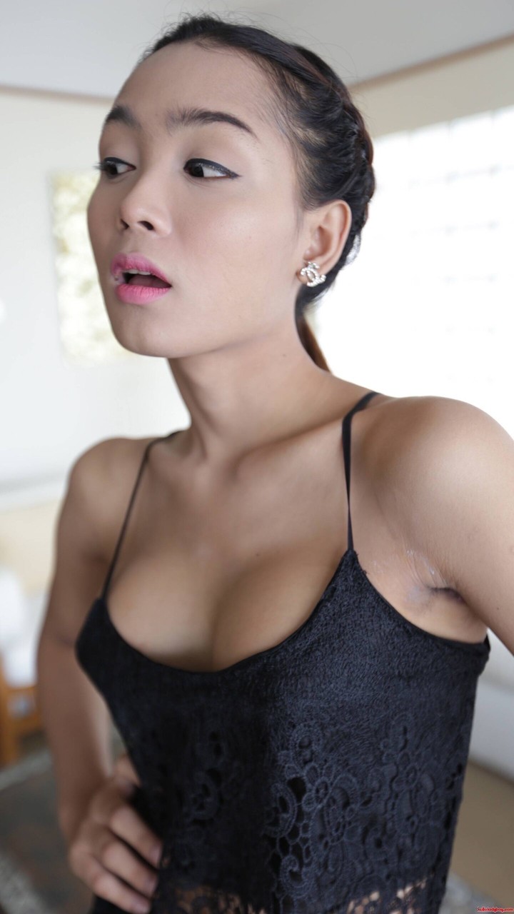 Pretty Asian shemale shows her tiny tits  