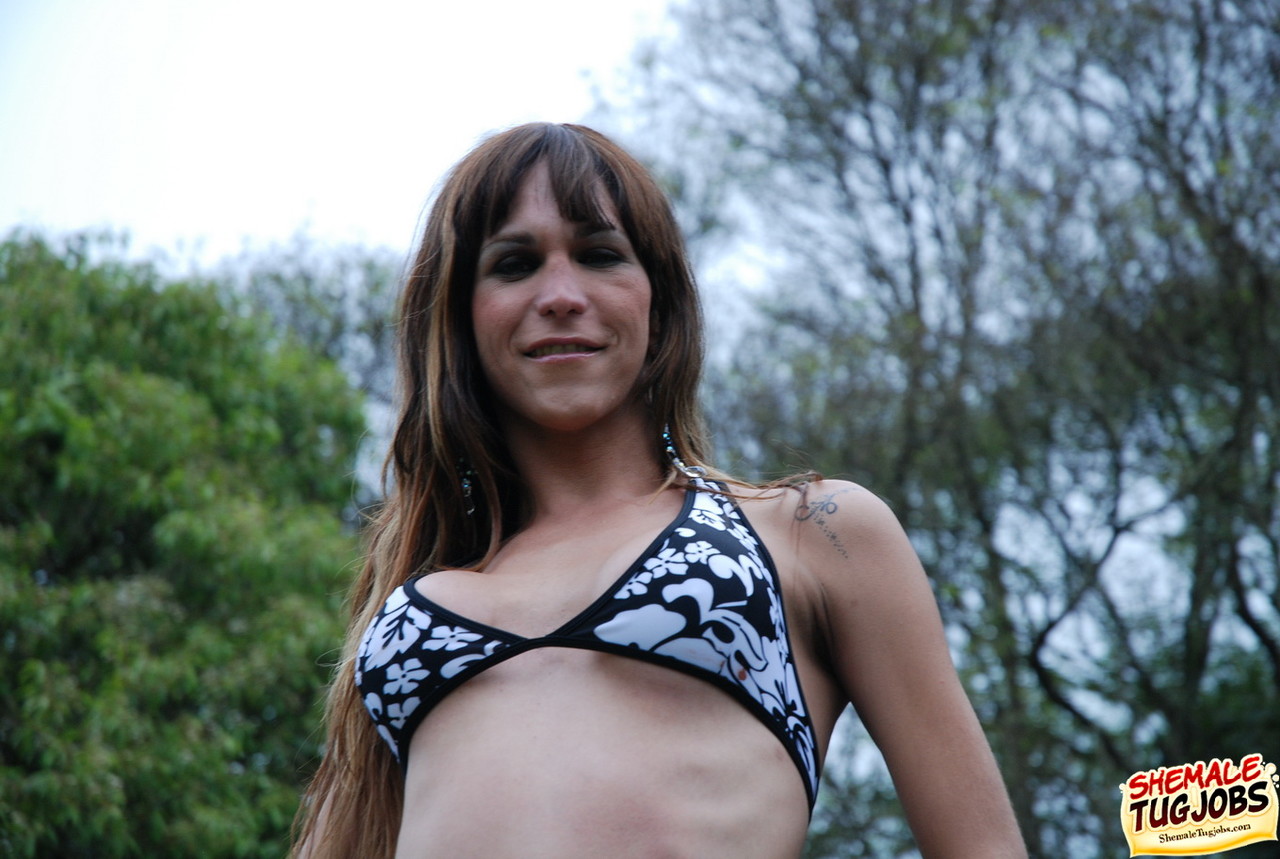 Hot shemale Latina Alexia Firenze loses her bikini & strokes her dick outside  