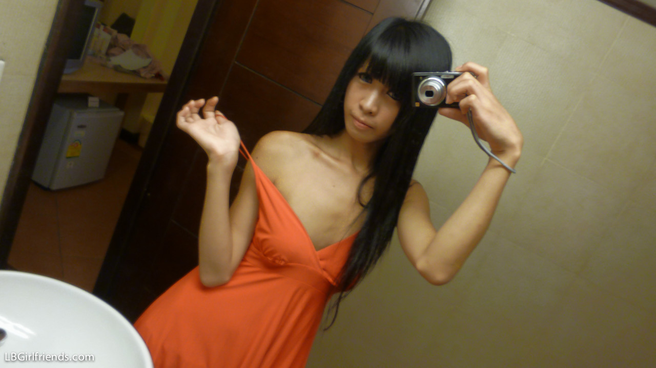 Skinny Asian ladyboys takes mirror selfies  